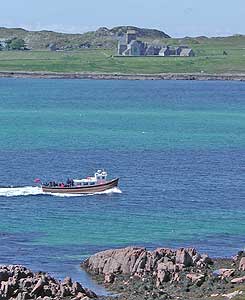 MV Iolaire with Iona Abbey in background